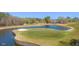 Scenic golf course with water hazard and sand trap, providing a challenging and beautiful setting at 11548 Helmond Way # 120, Raleigh, NC 27617