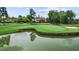 Picturesque golf course view with water feature and lush green fairways, perfect for a day on the links at 11548 Helmond Way # 120, Raleigh, NC 27617