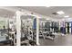 Community gym with modern weightlifting equipment and mirrors, promoting a healthy lifestyle at 11548 Helmond Way # 120, Raleigh, NC 27617