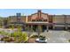 Exterior of movie theater with a grand entrance, covered drop-off area, and ample parking spaces at 11548 Helmond Way # 120, Raleigh, NC 27617