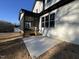 Backyard featuring a screened porch, white siding, and a concrete slab at 148 Hook Dr # 7, Fuquay Varina, NC 27526