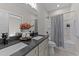 Bathroom featuring double sinks, a dark countertop, and a shower with striped curtain at 148 Hook Dr # 7, Fuquay Varina, NC 27526