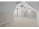 The spacious bedroom has two windows, neutral walls, and a unique ceiling fan at 148 Hook Dr # 7, Fuquay Varina, NC 27526