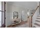 Welcoming entryway featuring hardwood floors, wainscoting, and decorative console table at 148 Hook Dr # 7, Fuquay Varina, NC 27526