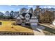 Beautiful two-story home with a combination of brick and siding, complemented by a well-manicured lawn at 148 Hook Dr # 7, Fuquay Varina, NC 27526