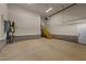 Spacious garage with staircase leading to the upper level and utility closet at 148 Hook Dr # 7, Fuquay Varina, NC 27526