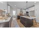 Kitchen with stainless steel appliances, an island with seating, and contrasting cabinetry at 148 Hook Dr # 7, Fuquay Varina, NC 27526