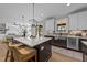 Kitchen featuring a large island with bar seating and a view of the living room and screened-in porch at 148 Hook Dr # 7, Fuquay Varina, NC 27526