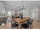 Bright kitchen featuring a large island, stainless steel appliances, and a wooden dining table at 148 Hook Dr # 7, Fuquay Varina, NC 27526