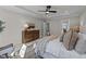 Comfortable main bedroom features a dresser, a cozy bed with lots of pillows, and neutral decor at 148 Hook Dr # 7, Fuquay Varina, NC 27526