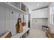 Bright mudroom area with built-in shelving, coat hooks, bench and lots of cabinet storage at 148 Hook Dr # 7, Fuquay Varina, NC 27526
