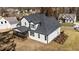 An elevated view of a home featuring a screened porch, white siding, and a dark gray roof at 148 Hook Dr # 7, Fuquay Varina, NC 27526