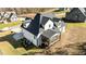 New construction showing a back deck, white siding and dark roof in a manicured yard at 148 Hook Dr # 7, Fuquay Varina, NC 27526