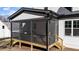 Screened porch featuring black railing and white siding, offering a cozy outdoor space at 148 Hook Dr # 7, Fuquay Varina, NC 27526