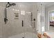 Modern shower with glass enclosure, tile surround, rainfall showerhead, and built-in niche at 148 Hook Dr # 7, Fuquay Varina, NC 27526