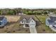 An aerial view of a house with a light blue exterior at 65 Diamond Creek Dr, Zebulon, NC 27597