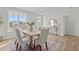 Bright and airy dining room, featuring a wooden table with seating and views of the outdoors at 65 Diamond Creek Dr, Zebulon, NC 27597