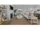 Cozy living room with a fireplace, large windows, and comfortable seating at 65 Diamond Creek Dr, Zebulon, NC 27597