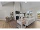 Comfortable living room featuring a fireplace, large windows, and neutral decor at 65 Diamond Creek Dr, Zebulon, NC 27597