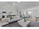 Inviting open-concept living space with a spacious living room, dining area, and modern kitchen at 65 Diamond Creek Dr, Zebulon, NC 27597