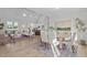 Open-concept living space showcasing a dining area, kitchen with bar seating, and a cozy living room at 65 Diamond Creek Dr, Zebulon, NC 27597