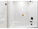 A full tub and shower combination with a black shower head and modern fixtures at 108 Nakoma Dr, Louisburg, NC 27549