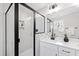 Modern bathroom with sleek glass shower enclosure, white vanity, and contemporary fixtures at 108 Nakoma Dr, Louisburg, NC 27549