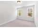 Light and airy bedroom with neutral carpet, two windows, and fresh trim at 108 Nakoma Dr, Louisburg, NC 27549