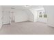 Lofted bedroom with neutral carpet, a dormer window, and a hallway to another room at 108 Nakoma Dr, Louisburg, NC 27549