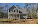 View of home's exterior featuring back porch, vinyl siding, and manicured backyard at 108 Nakoma Dr, Louisburg, NC 27549