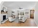 Comfortable living room featuring a fireplace, hardwood floors, and plenty of natural light at 108 Nakoma Dr, Louisburg, NC 27549