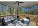 Covered outdoor patio with a ceiling fan and stylish furniture perfect for relaxing at 108 Nakoma Dr, Louisburg, NC 27549