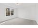 Bedroom featuring neutral walls, carpet flooring, and a window for natural light at 158 Nakoma Dr, Louisburg, NC 27549