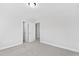 Bedroom featuring neutral walls, carpet flooring, and an open closet for easy storage at 158 Nakoma Dr, Louisburg, NC 27549