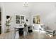 Charming dining room featuring a modern table, stylish chandelier, and bright natural light at 158 Nakoma Dr, Louisburg, NC 27549
