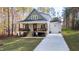 Charming two-story home with a welcoming front porch and well-manicured lawn at 158 Nakoma Dr, Louisburg, NC 27549