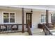 Inviting front porch with cozy seating, perfect for relaxing and enjoying the outdoors at 158 Nakoma Dr, Louisburg, NC 27549