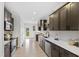 Well-equipped kitchen boasts dark wood cabinetry, stainless steel appliances, and ample counter space at 158 Nakoma Dr, Louisburg, NC 27549