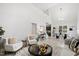 Bright and airy living room with vaulted ceilings and stylish, modern decor at 158 Nakoma Dr, Louisburg, NC 27549