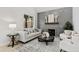 Cozy living room featuring a modern fireplace and comfortable seating arrangements at 158 Nakoma Dr, Louisburg, NC 27549
