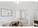 Neutral-toned living room area with decorative furnishings, neutral carpet and white walls at 158 Nakoma Dr, Louisburg, NC 27549