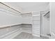 Walk-in closet equipped with shelves, rods, and carpet at 158 Nakoma Dr, Louisburg, NC 27549