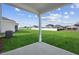 Enjoy the view of a spacious backyard with lush green grass at 305 Chestnut Oak Ln, Lillington, NC 27546