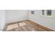 Cozy bedroom featuring wood floors and natural light at 305 Chestnut Oak Ln, Lillington, NC 27546