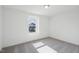 A cozy bedroom featuring plush carpeting and ample natural light at 305 Chestnut Oak Ln, Lillington, NC 27546