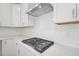 Gas range on a white countertop with white cabinets and a white subway tile backsplash at 305 Chestnut Oak Ln, Lillington, NC 27546