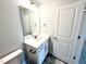 Elegant bathroom with modern vanity, mirror, fixtures, and tile flooring at 114 Southern Estates Dr, Sanford, NC 27330
