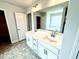Primary bathroom featuring double sink vanity and large mirror at 114 Southern Estates Dr, Sanford, NC 27330
