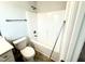 Bathroom with a toilet, sink, and shower/tub combination, showcasing functionality at 114 Southern Estates Dr, Sanford, NC 27330