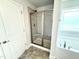 Modern bathroom showcasing a tiled shower with glass doors and a built-in bench at 114 Southern Estates Dr, Sanford, NC 27330